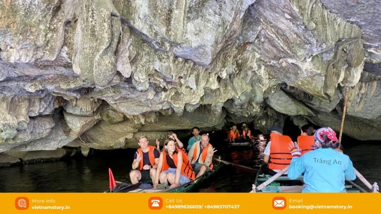 Visitors travelling by boat on a Trang An route in Ninh Binh
