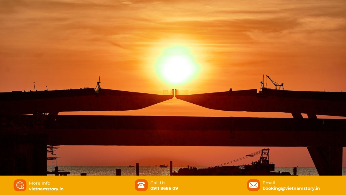 A couple taking a photo on the Kiss Bridge, showcasing the scale and design of the structure. A couple taking a photo on the Kiss Bridge, showcasing the scale and design of the structure.