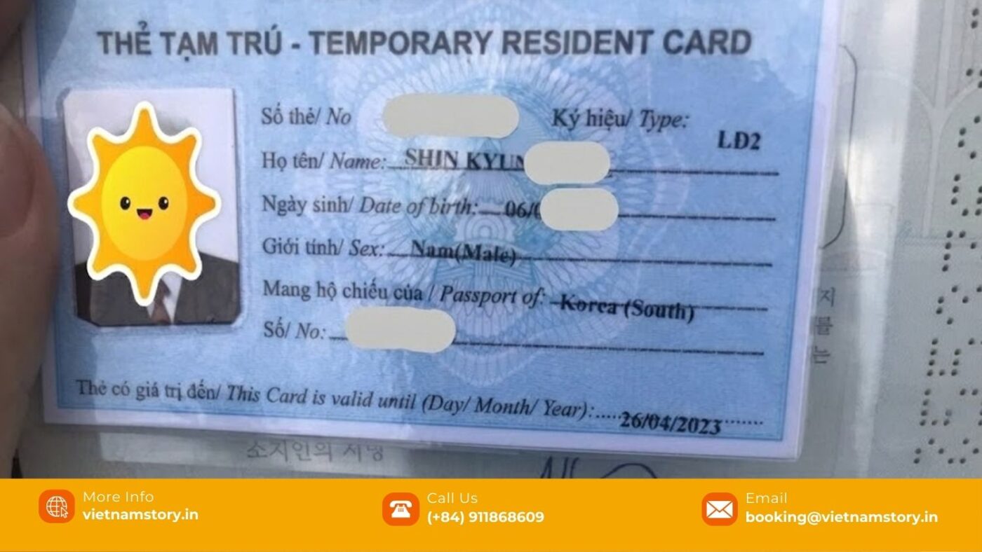 Traveller filling out Vietnam e-visa application online on a laptop with passport and documents nearby