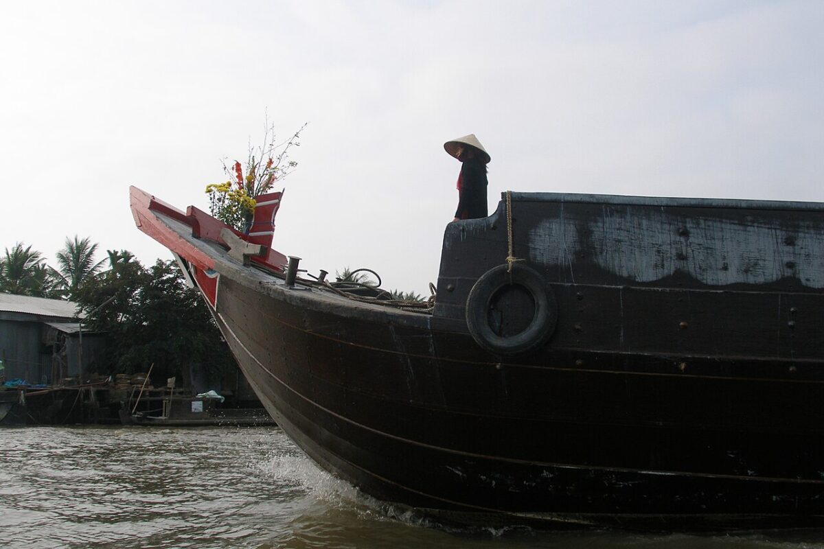 Boat and river scene in Phong Dien, Mekong Delta, representing the river block of a South Vietnam itinerary