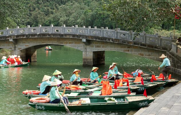 Tour boats at Trang An in Ninh Binh, representing the North Vietnam route we recommend for a focused five-day itinerary
